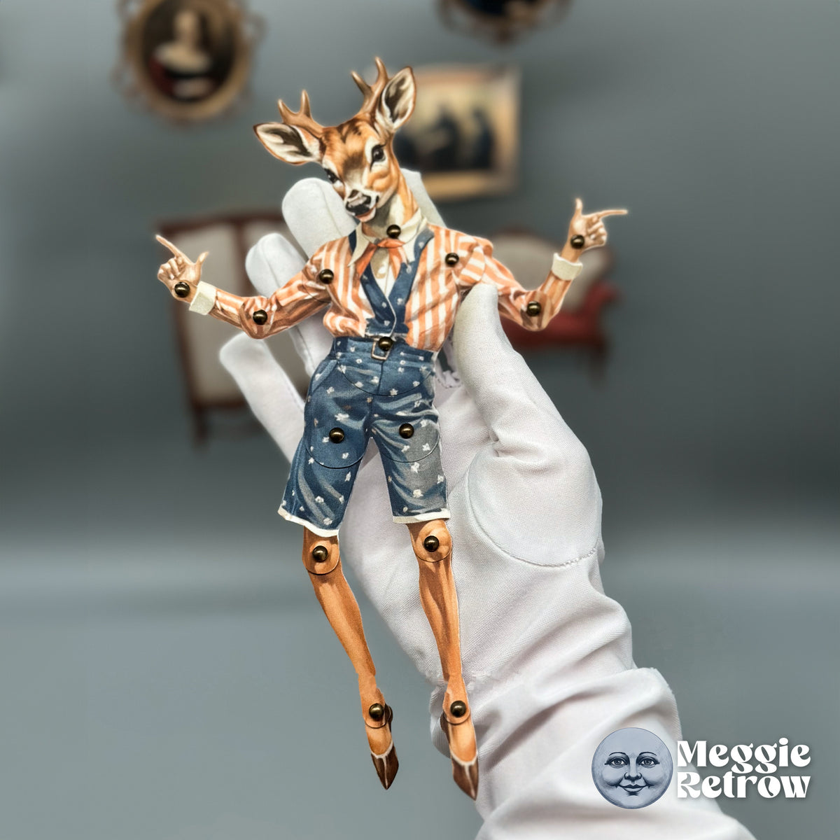 Deerberty, a printable articulated paper doll. A deer in a striped shirt and blue overall shorts, on long hoofed legs.