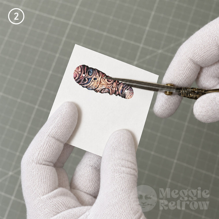 Cutting a part out with small scissors