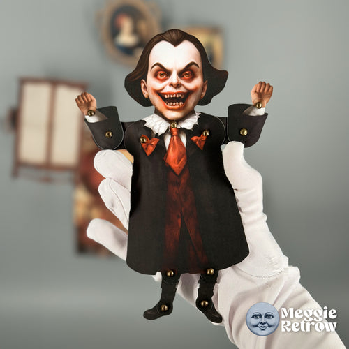 Lovable Scary Heart Dracula, a printable articulated paper doll. A black coat and a wide, toothy grin.