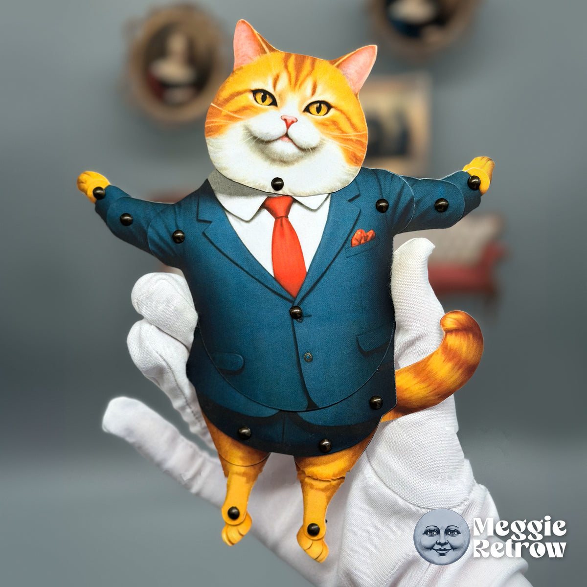 Mogul Meow, a printable articulated paper doll. A ginger cat in a blue suit with a red tie.