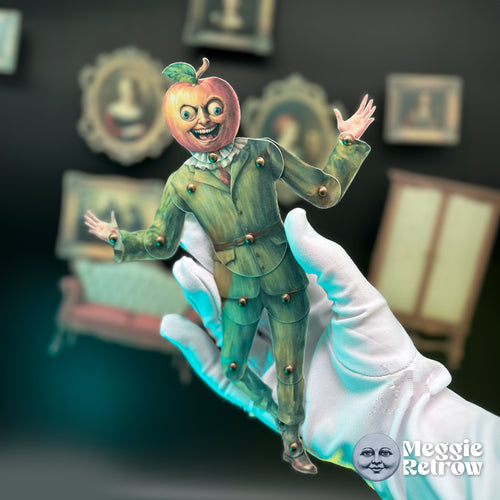 Mr. Appler, a printable articulated paper doll. An apple head above a green suit with a ruffled collar.