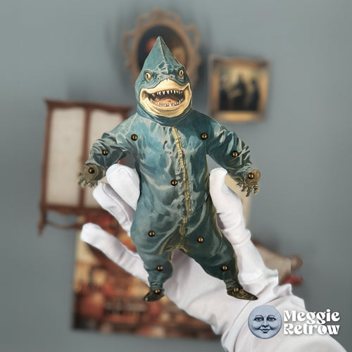 Mr. Sharky, a printable articulated paper doll. A toothy shark in a teal one-piece suit.
