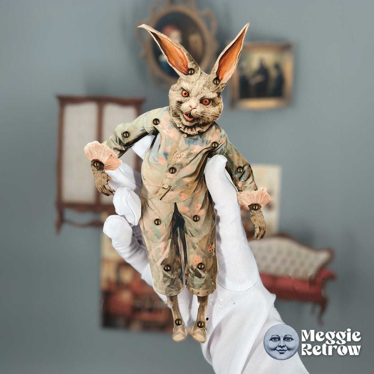 Nancy Rabbit, a printable articulated paper doll. A gray rabbit in pale green with frilled pink cuffs.