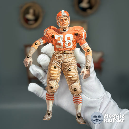 Quarterback, a printable articulated paper doll. Orange jersey, leather helmet, and padded pants.