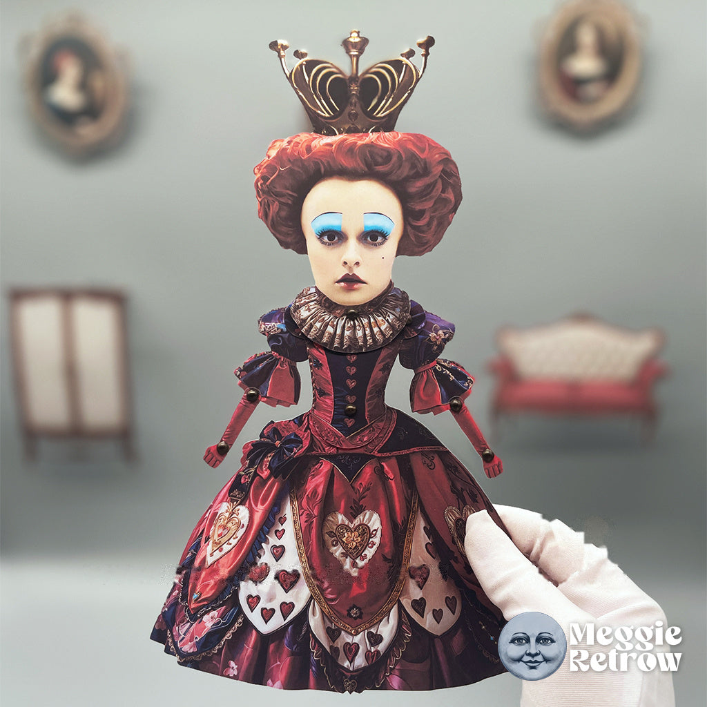 Red Queen, a printable articulated paper doll. Blue eyelids and a gown covered in hearts.