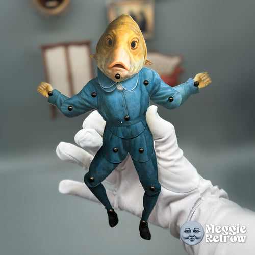Yawn Guppy, a printable articulated paper doll. A golden fish head with small fins above a blue suit.