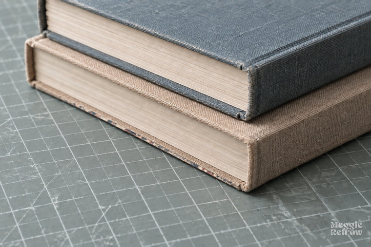 Sheet drying under a stack of books