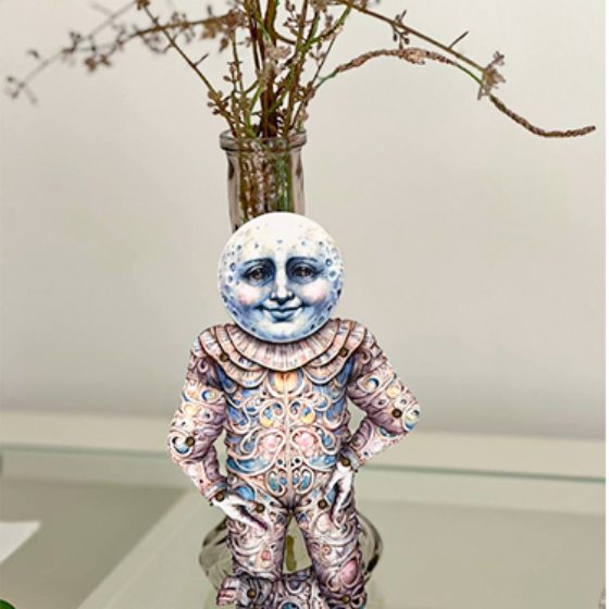 A finished doll standing on a shelf