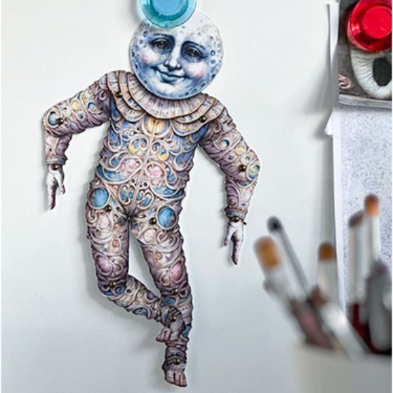 A doll on a fridge magnet