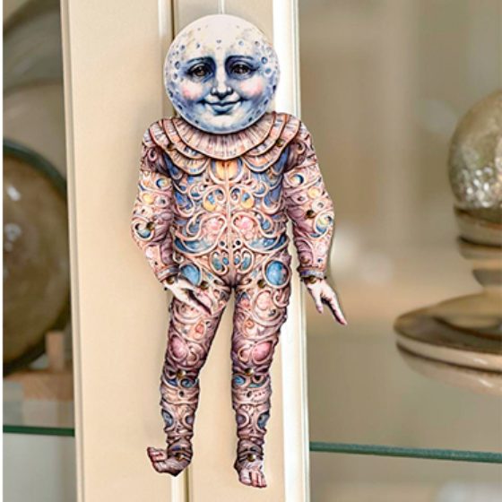 A doll in a small frame